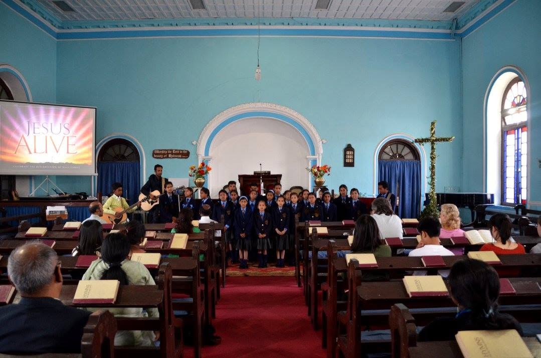 Wooden pews with hymnals inside Union Church, Mussoorie